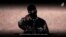 image grab taken from a video published by the media branch of the Islamic State (IS) group in the Raqa province (Welayat Raqa) on Jan. 3, 2016, purportedly shows an English-speaking IS fighter speaking to the camera at an undisclosed location.