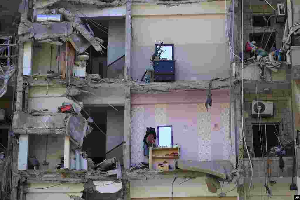 Damaged furniture is seen in destroyed apartments that were hit by Israeli airstrikes, in Tyre, south Lebanon.