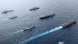 British, Canadian and Japanese vessels sail together in the Pacific Ocean on Septemebr 2021. The U.S. and its allies are becoming assertive in their approach toward a rising China. (UK Ministry of Defence via AP)