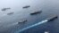 British, Canadian and Japanese vessels sail together in the Pacific Ocean on Septemebr 2021. The U.S. and its allies are becoming assertive in their approach toward a rising China. (UK Ministry of Defence via AP)