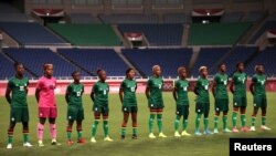 FILE - Zambia players before a match at the 2020 Tokyo Olympics in Saitama, Japan, July 27, 2021. 