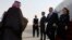 US Secretary of State Mike Pompeo, second right, and his wife Susan are met by a member of Saudi protocol as they arrive at the King Khalid International Airport in the Saudi capital Riyadh, Feb. 19, 2020.