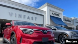 FILE - VinFast electric vehicles are parked before delivery to their first customers at a store in Los Angeles, California, March 1, 2023. 