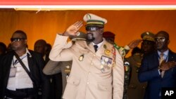 FILE — Guinea's junta leader Col. Mamady Doumbouya salutes during an independence day military parade in Bamako, Sept. 22, 2022. 