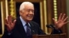 FILE PHOTO: Former U.S. President Jimmy Carter delivers a lecture on the eradication of the Guinea worm, at the House of Lords in London