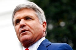 FILE - Rep. Mike McCaul, R-Texas, speaks with members of the media outside of the White House, Oct. 16, 2019.