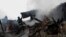Firefighters work at the site of residential buildings hit by a Russian drone strike in Kharkiv, Ukraine, Dec. 25, 2024.