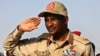 FILE - General Mohammed Hamdan Dagalo salutes during a rally in Galawee, Sudan, on June 15, 2019. The United States announced on Jan. 7, 2025, sanctions on Dagalo, also known as Hemedti, that bar him from traveling to the U.S. and freeze any U.S. assets he might hold.