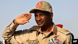 FILE - General Mohammed Hamdan Dagalo salutes during a rally in Galawee, Sudan, on June 15, 2019. The United States announced on Jan. 7, 2025, sanctions on Dagalo, also known as Hemedti, that bar him from traveling to the U.S. and freeze any U.S. assets he might hold.