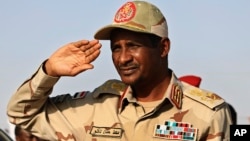 FILE - Rapid Support Forces leader Mohammad Hamdan Daglo Mousa salutes during a rally in Galawee, Sudan, June 15, 2019. Daglo, of Darfur, is widely known as Hemedti and on Jan. 7, 2024, was placed under U.S. sanctions.