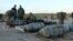 Libyan soldiers loyal to Libya's internationally recognized government work next to bombs at the Benina air base on Dec. 10, 2015, south of the eastern coastal city of Benghazi. 