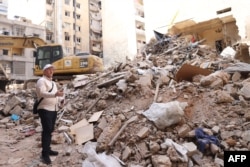 Dagestan deputy Mufti Shehabeddin Husseinov inspects the damage to a building hit in an Israeli airstrike in Beirut's Basta neighborhood on Oct. 17, 2024.