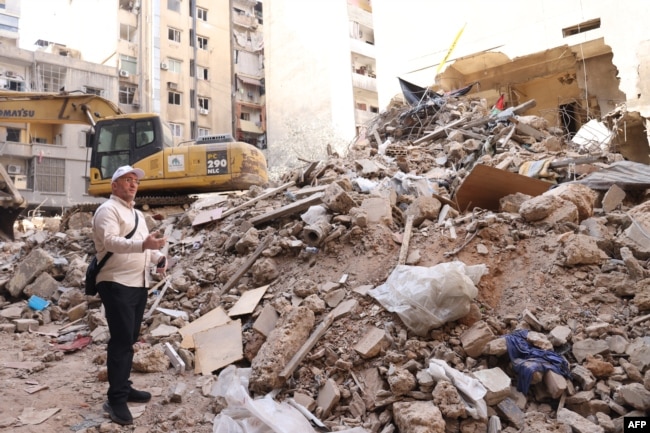 Dagestan deputy Mufti Shehabeddin Husseinov inspects the damage to a building hit in an Israeli airstrike in Beirut's Basta neighborhood on Oct. 17, 2024.