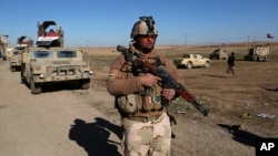 Iraqi Army soldiers deploy after defeating Islamic State militants in the eastern side of Mosul, Jan. 24, 2017.