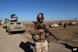 FILE - Iraqi Army soldiers deploy after defeating Islamic State militants in the eastern side of Mosul, Iraq, Jan. 24, 2017.