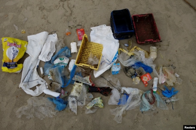 FILE - Plastic items washed up by the sea are seen at the Ao Phrao Beach, on the island of Ko Samet, Thailand, June 9, 2018.