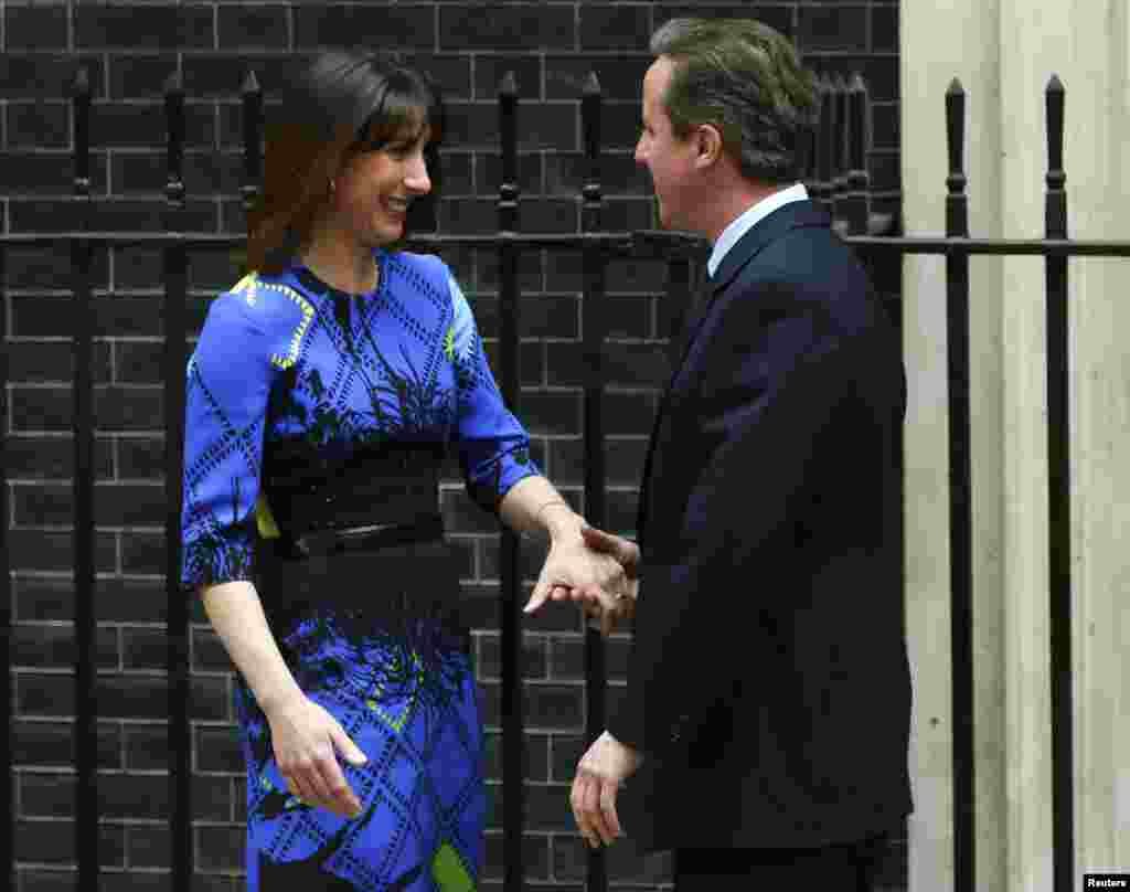 Samantha Cameron congratulates Prime Minister David Cameron after his speech outside Number 10 Downing Street announcing that he would would form a new majority goverment in London, May 8, 2015.