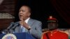 FILE - Kenya President Uhuru Kenyatta delivers a speech during Mashujaa Day -- also known as Heroes Day -- at the Nyayo Nationa Stadium, in Nairobi, Kenya, Oct. 20, 2014. 