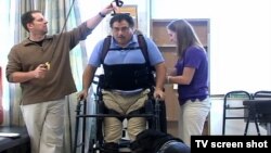 A paralyzed man wears a bionic skeleton to help him walk again.
