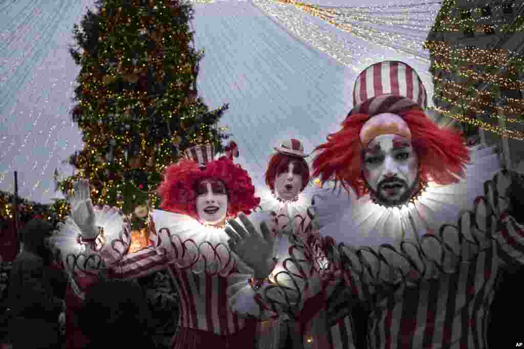 Performers are seen at Holiday&#39;s Market near Red Square, set up for New Year and Orthodox Christmas celebrations, in Moscow, Russia.