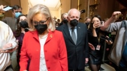 Former Vice President Dick Cheney walks with his daughter Rep. Liz Cheney, R-Wyo., vice chair of the House panel investigating the Jan. 6 U.S. Capitol insurrection, in the Capitol Rotunda at the Capitol in Washington, Jan. 6, 2022.