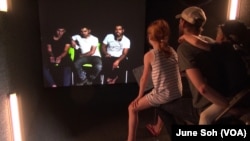 Iraqi refugees living at a refugee camp and festival attendees in Washington interact directly through a digital portal called Shared Studio, which was set up at the One Journey festival in last June.