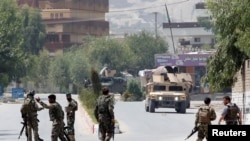 Afghan National Army (ANA) soldiers arrive at the site of gunfire and attack in Jalalabad city, Afghanistan, July 11, 2018. 