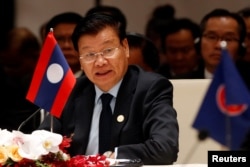 Laos' Prime Minister Thongloun Sisoulith speaks at the 10th Cambodia-Laos-Vietnam summit as part of the Greater Mekong Subregion Summit in Hanoi, Vietnam, March 31, 2018.