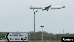 FILE - A plane comes in to land at Stansted Airport, in Stansted, near London Britain, April 16, 2020. 