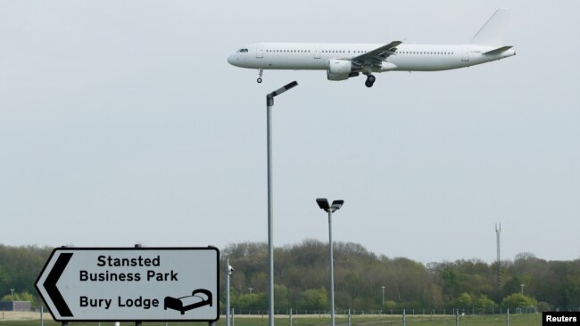 FILE - A plane comes in to land at Stansted Airport, in Stansted, near London Britain, April 16, 2020.