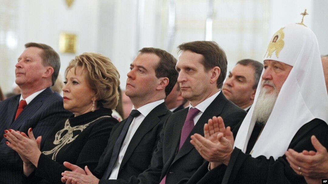Russian dignitarites applaud before President Vladimir Putin's state-of-the nation address in the Kremlin in Moscow, Dec. 12, 2012.