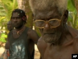 Elders among the Carteret, pictured here at a relocation meeting on Piul Island, hold memories of happier days but now must seek shelter elsewhere.