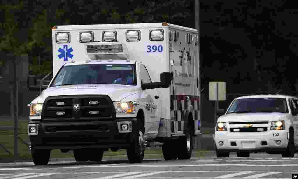 An ambulance transporting an American infected with the deadly Ebola virus leaves Dobbins Air Reserve Base in Marietta, Georgia headed for Emory University Hospital in Atlanta, Sept. 9, 2014.