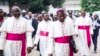 FILE - Archbishop Marcel Utembi, second left, president of the National Episcopal Conference of Congo (CENCO), and other Catholic bishops arrive for the signing of an accord at the interdiocesan center in Kinshasa, Jan. 1, 2017 following talks launched by the Roman Catholic Church between the government and opposition. The bishops have ended their mediation efforts between the Rassemblement and President Joseph Kabila's political alliance. 