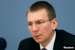 FILE - Latvian Foreign Minister Edgars Rinkevics attends a news conference in Riga, Jan. 25, 2012.