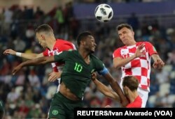 Croatia and Nigeria go head to head in a June 16 game that Croatia wins 2-0. Croatia's bold, checkered 'home' jerseys skip the subtlety of their 'away' uniforms. (Reuters)