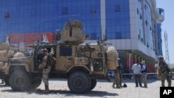 U. S. soldiers inspect the site of a suicide bombing in Samangan province north of Kabul, Afghanistan, Saturday, July, 14, 2012. 