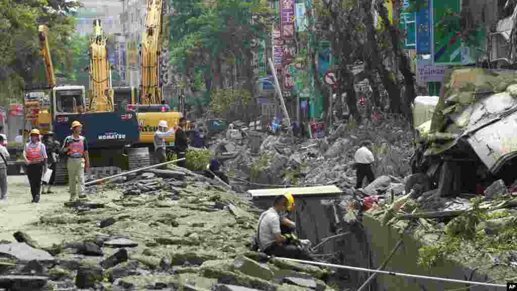 Emergency workers survey the damage from a massive gas explosion in Kaohsiung, Taiwan, Aug. 1, 2014. 
