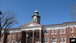 White Hall, one of many Tuskegee University buildings constructed by the hands of students, opened in 1909. Its clock tower is a campus landmark.