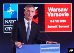 NATO Secretary General Jens Stoltenberg, right, speaks during the Warsaw Experts Forum prior to the official opening of the NATO summit in Warsaw, Poland, July 8, 2016.