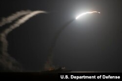 FILE - The guided-missile cruiser USS Philippine Sea launches a Tomahawk cruise missile as seen from the aircraft carrier USS George H.W. Bush, Sept. 23, 2014. Such tools are used by the U.S. military to combat surface-to-air missiles. (U.S. Navy photo by Mass Communication Specialist 1st Class Eric Garst/Released)