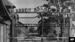 FILE - This undated file image shows the main gate of the Nazi concentration camp Auschwitz I.