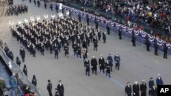 The U.S. Army band marches down Pennsylvania Avenue en route to the White House during the Inaugural parade, Jan. 21, 2013. 