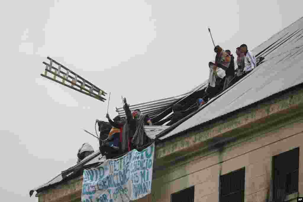 Rioting inmates protest that authorities are not doing enough to prevent the spread of coronavirus inside the prison, at the Villa Devoto prison in Buenos Aires, Argentina.