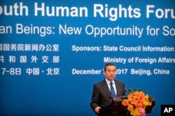 Chinese Foreign Minster Wang Yi speaks during the South-South Human Rights Forum at the Great Hall of the People in Beijing, Dec. 7, 2017.