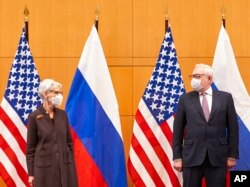 FILE - U.S. Deputy Secretary of State Wendy Sherman, left, and Russian deputy foreign minister Sergei Ryabkov attend security talks at the United States Mission in Geneva, Switzerland, Jan. 10, 2022.