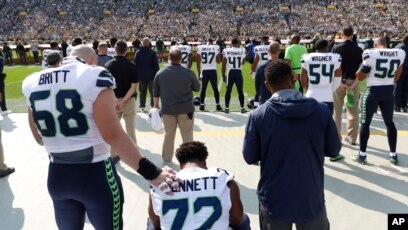 Michael Bennett says he's standing for the National Anthem because his  Cowboys teammates asked him to