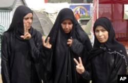 Badria, right, with two friends on Pearl Roundabout, March 12, 2011