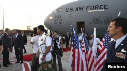 U.S. Secretary of Defense Leon Panetta (2nd L) is welcomed after arriving in Tel Aviv, Israel July 31, 2012. 