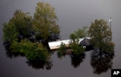 Floodwaters surround a trailer in the aftermath of Hurricane Florence in Pollocksville, N.C., Sept. 17, 2018.